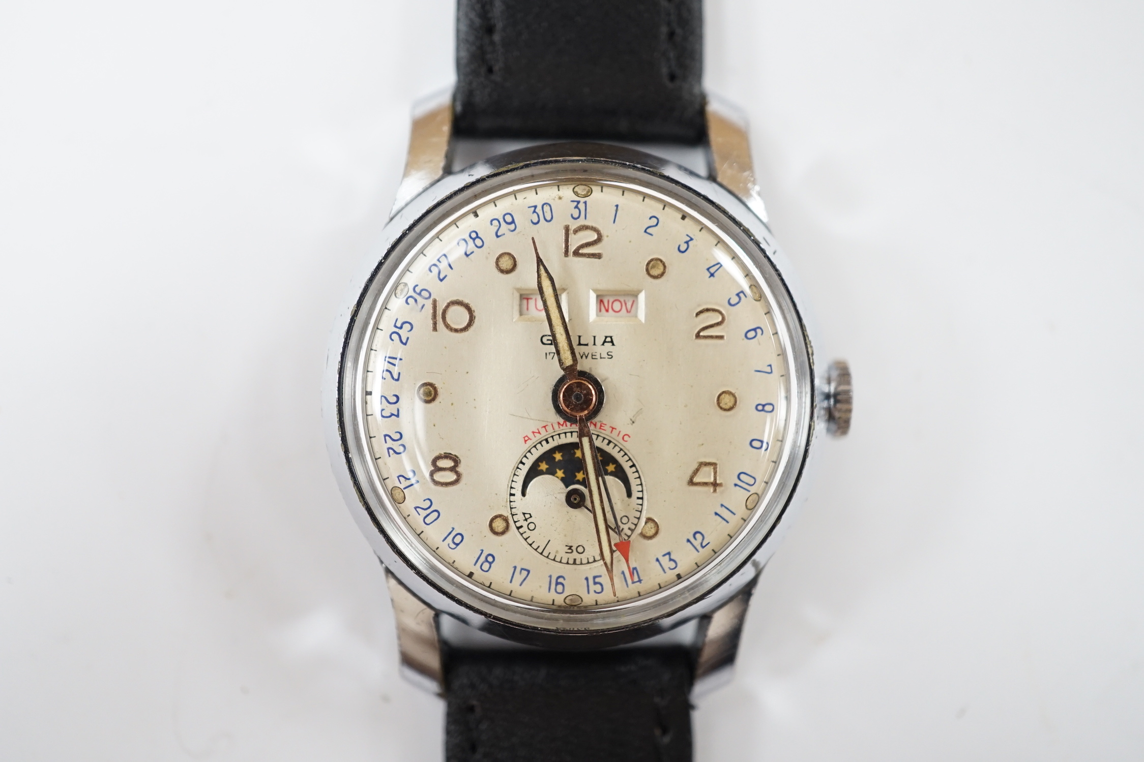 A gentleman's 1950's? stainless steel Galia calendar moonphase manual wind wrist watch, on an associated leather strap, case diameter 32mm.